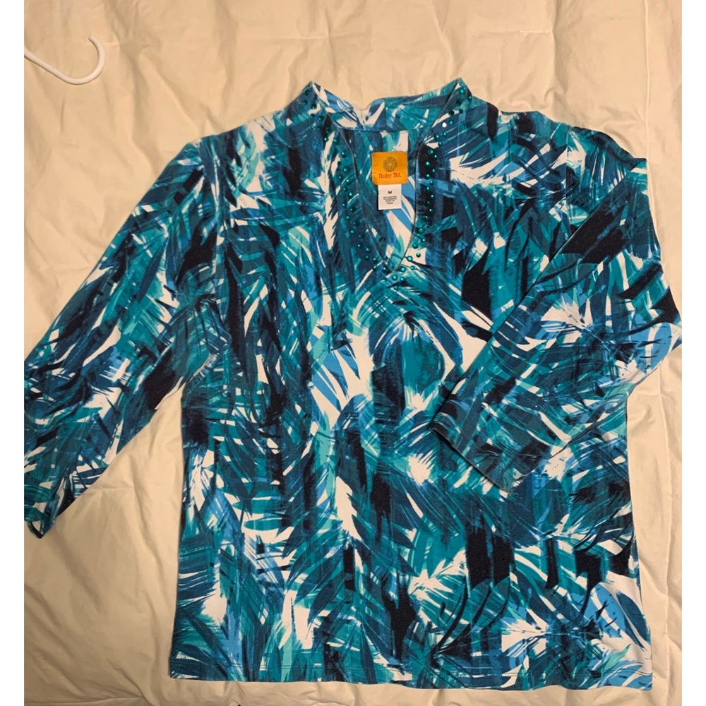 3/4 sleeve, size M blue, white, black top. Blue faux jeweled V neckline